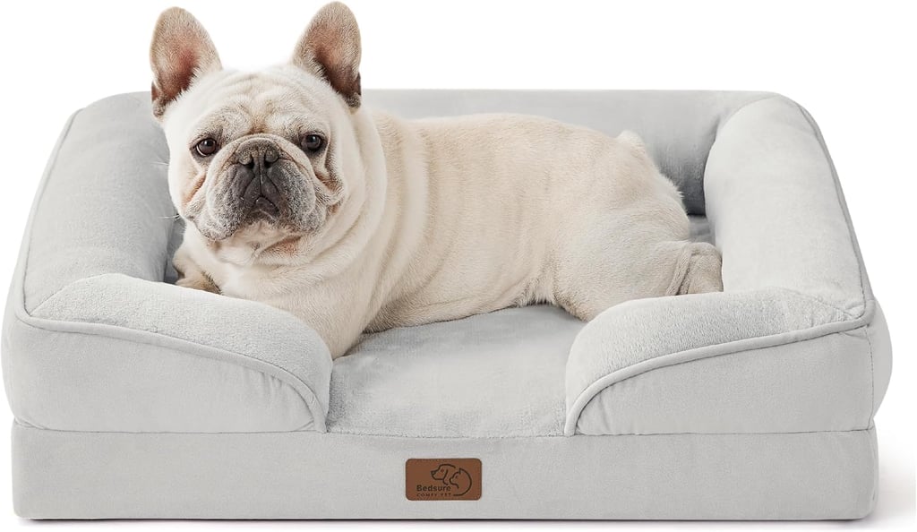 Bedsure Orthopedic Dog Bed ($50, originally $55)
I could actually wax poetic about this orthopedic dog bed from Bedsure. It's been our favorite by far, made with high-density egg-crate foam for joint support, a waterproof layer that helps keep the cushion dry in the event of a spill or accident, and a removable cover you can toss in the washer. A happy bonus: The size designed for medium dogs is big enough to house a Lex and Theo cuddle puddle, and yes, that's as cute as it sounds.