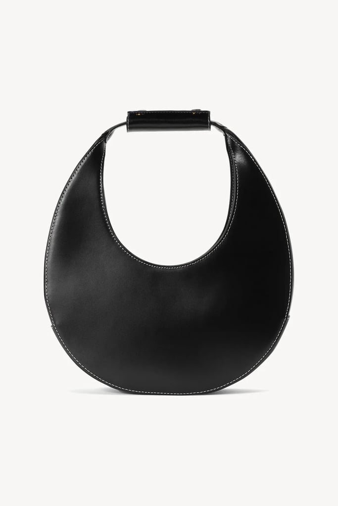 Staud Moon Bag ($263, originally $350)
I use this bag more than almost anything else in my wardrobe. It's versatile, chic, and perfect for the fashion-lover who packs light but still wants a bag with real personality. The interior is small, but it fits all the essentials — and the compliments are nonstop. For its Cyber Monday sale, you can get 35 percent off sitewide. Use code SITEWIDE35. Read more about why I love this bag in my Staud Moon Bag review.
Editor Quote: "What I love about the Staud Moon Bag is that it manages to be both timeless and unique — a rare combination in the world of handbags. I have the black leather version, and it's truly a chameleon piece. No matter what outfit I'm wearing, no matter the season, this bag complements it perfectly, adding a special touch without overpowering the look. I've probably worn it over 100 times by now and it never fails to spark compliments; I've had more than a few people ask where it's from." — Marisa Petrarca, contributing shopping editor