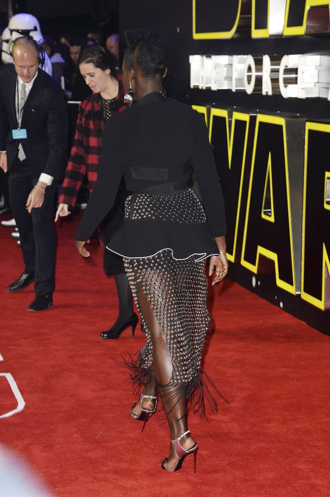 This is no doubt one of Lupita's sexiest looks, as the star showed a lot of leg through her skirt.