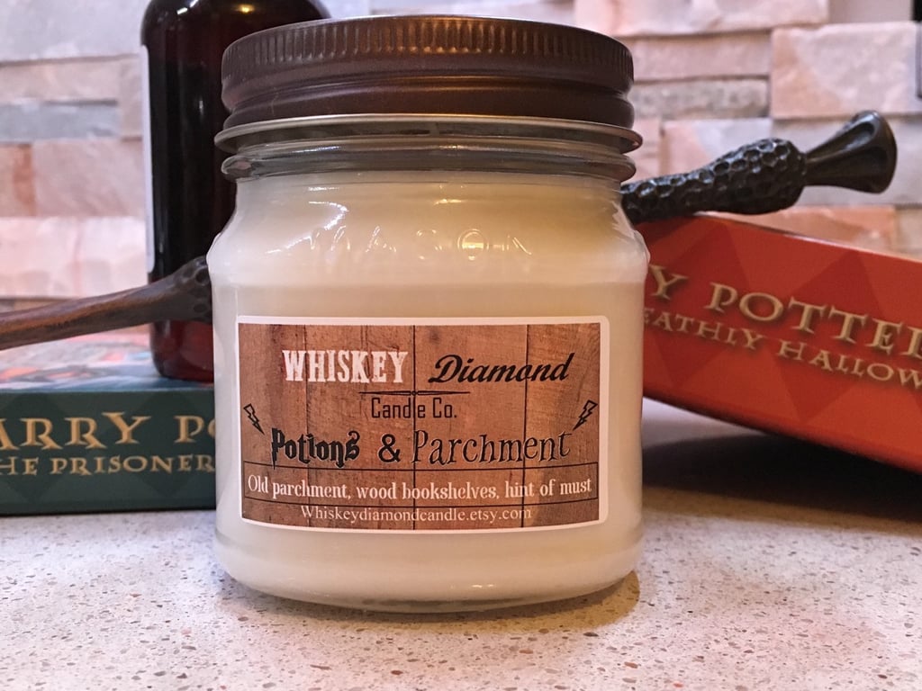 Potions and Parchment candle ($9) with old parchment, dusty bookshelves, and musty notes