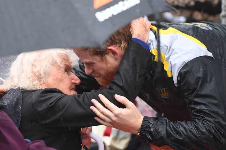 Harry hugged a 97-year-old woman in the pouring rain at The Rocks during his 2018 visit to Sydney.