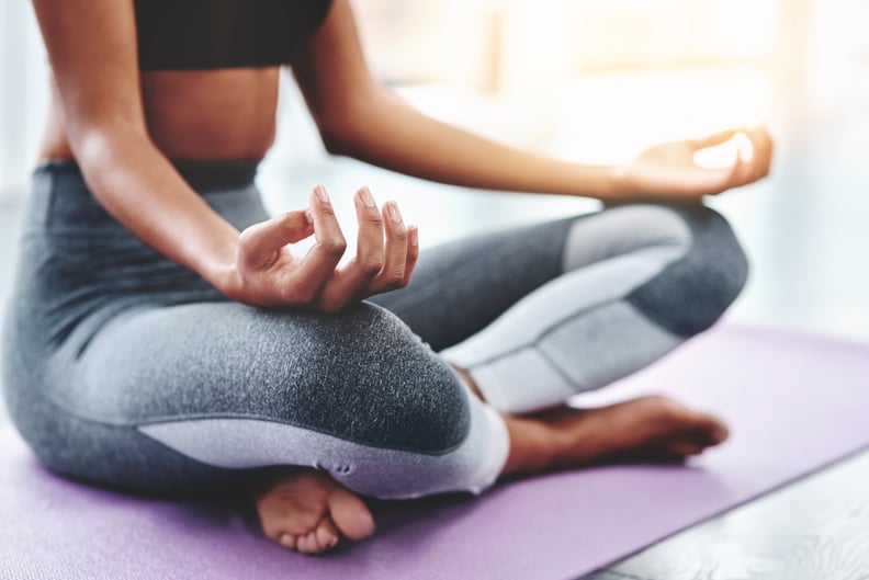 Cropped shot of an unrecognizable woman practising yoga