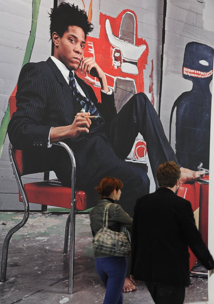A larger-than-life poster of artist Jean-Michel Basquiat on display at the Paris Museum of Modern Art in 2010 shows the American artist's signature style.