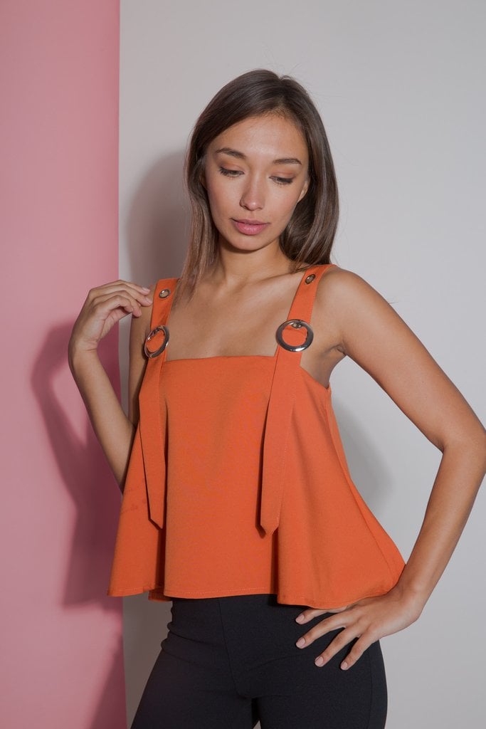 "Being rather small (and small chested at that), I’m always looking for tops that fit just right. Petite Studio offers women my size the chance to wear some pretty trendy looks. I love the orange shade of the Clementine Buckle Top ($79), but especially the adjustable buckle detail at the sleeves." — Sarah Wasilak, editor, Fashion