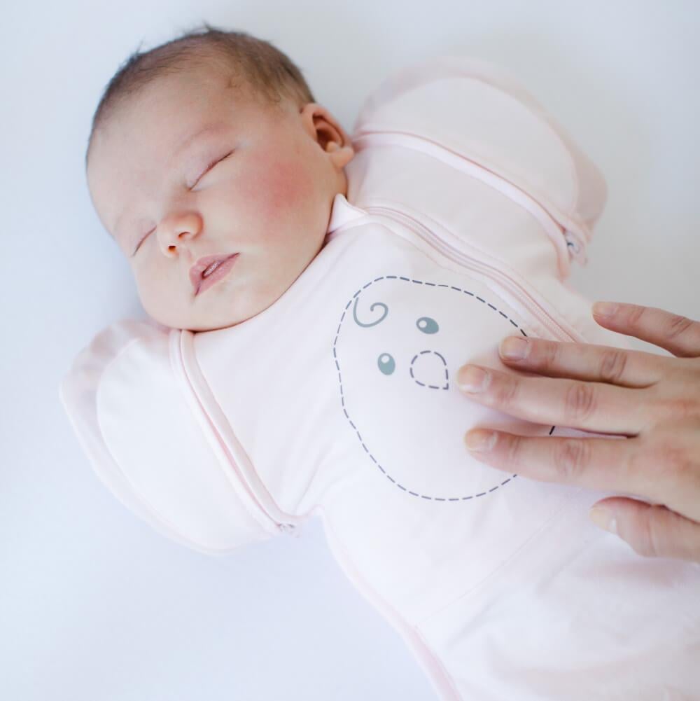 The Nested Bean Zen One Classic Swaddle ($45) in Soft Pink.