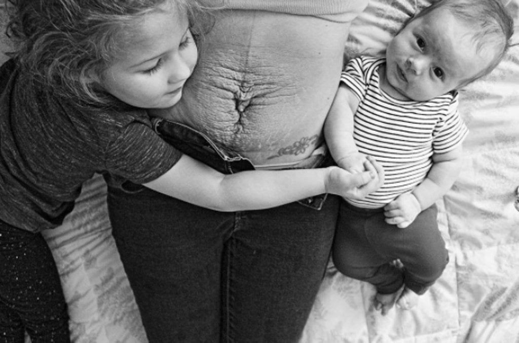 "After each of my pregnancies, I have looked at my body and wondered where the hell my 'perfect body' went, and when did my stomach become, according to my oldest daughter, 'old looking?'" But then I look at the baby fussing in her little bouncer and her rambunctious 3-year-old sister tending to her by putting her binky in her mouth, and I realise my body went to my children." — Nichole LaBreche Frank