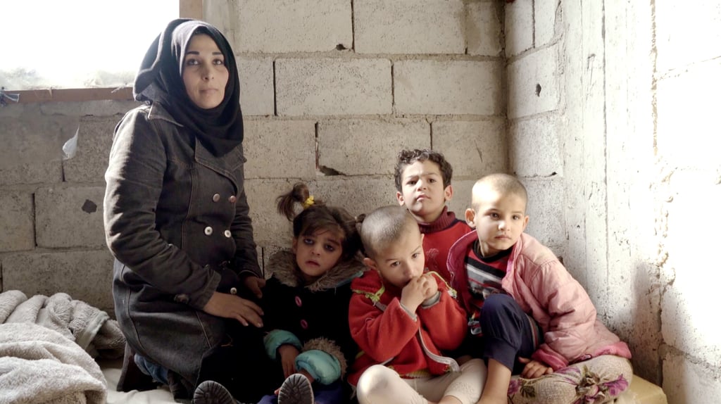 This is Rana with the four children she takes care of: Hala, Omar, Hib and Afaf. While Rana used to be a teacher, she told the Norwegian Red Cross that she had to stop working to look after the children and their safety. Rana's husband works as a tailor and will often bring back pieces of fabric from work to burn in the apartment and produce heat.