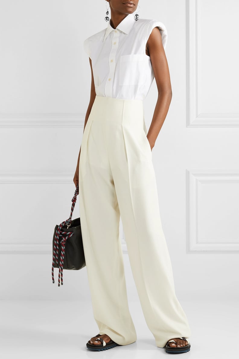 Dua Lipa's White Trousers With Circle Cutouts | POPSUGAR Fashion