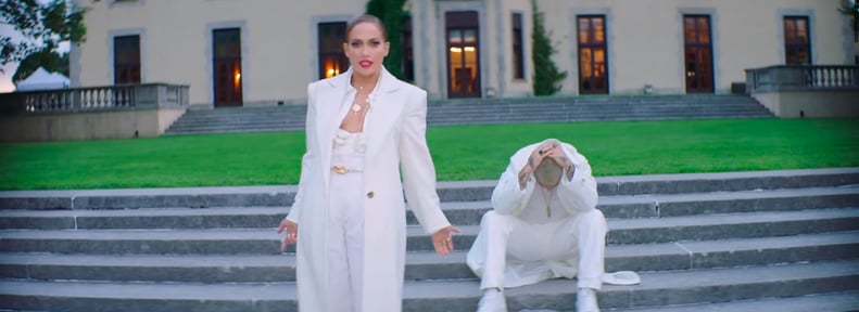 Jennifer Lopez Wearing a White Trench, Jumpsuit, and Gold Jewels