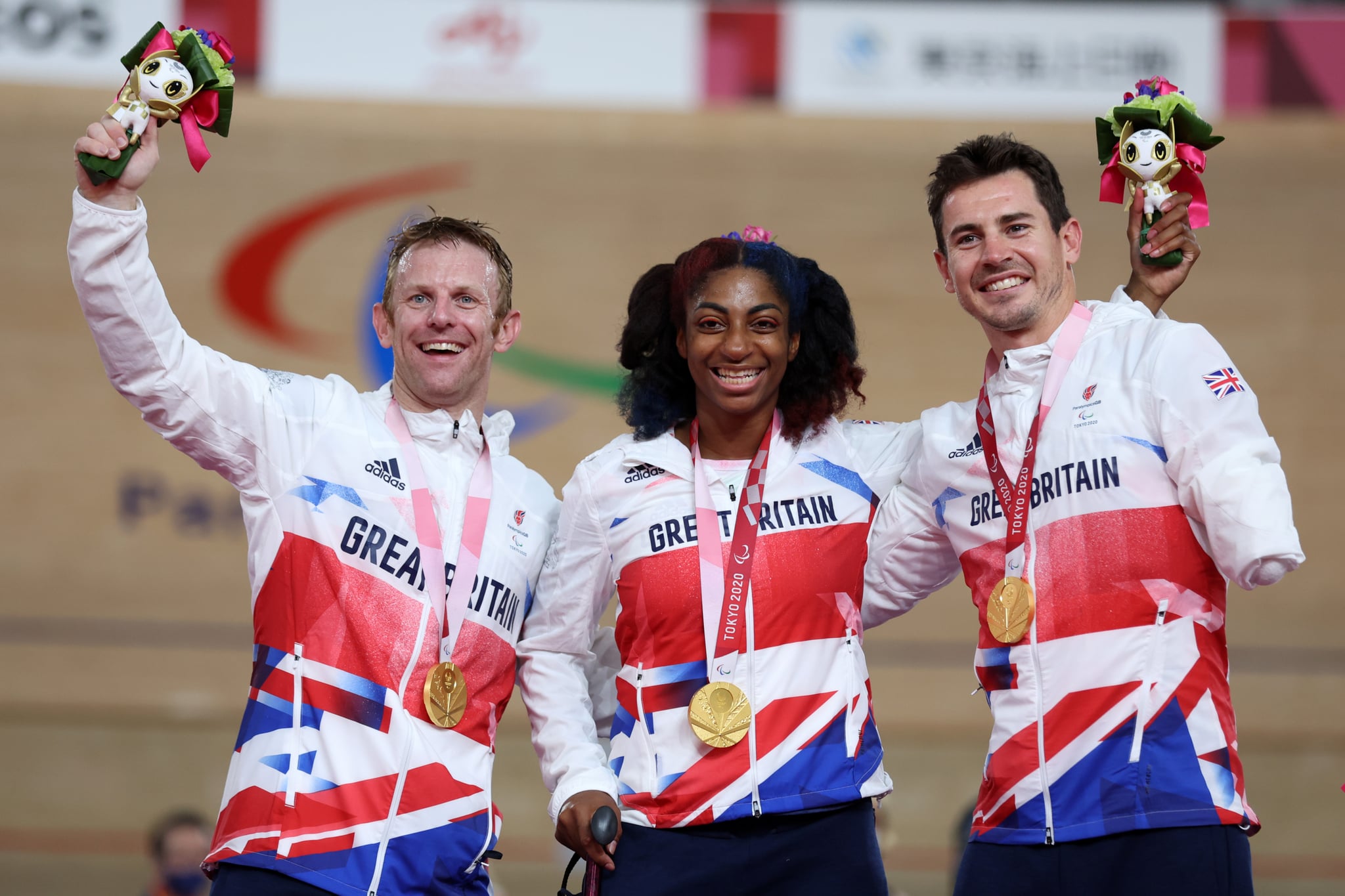 IZU, JAPAN - AUGUST 28: (L-R) Jody Cundy, Kadeena Cox and Jaco van Gass of Team Great Britain react after winning the gold medal in the Mixed C1-5 750m Team Sprint track cycling on day 4 of the Tokyo 2020 Paralympic Games at Izu Velodrome on August 28, 2021 in Izu, Japan. (Photo by Kiyoshi Ota/Getty Images)