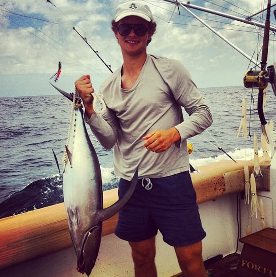 Warren posed with his catch when the pair went fishing together.
