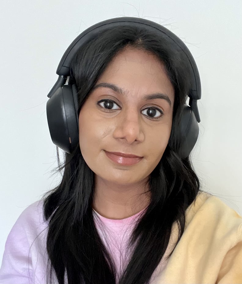 Woman wearing the  Sony WH-1000XM5 Noise Canceling Headphones.