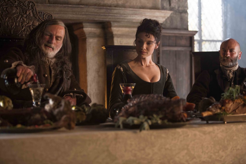 Colum MacKenzie (far left) and Dougal MacKenzie (far right) welcome Claire to their castle. 
Courtesy of Starz