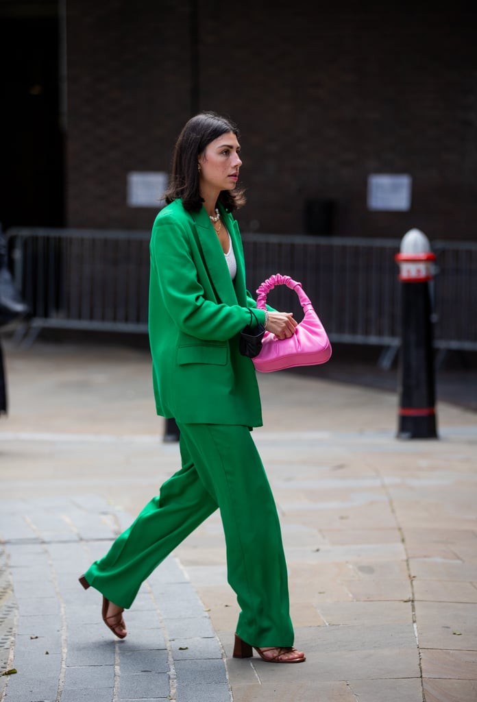 This applejack green suit pairs great with a fuchsia bag.