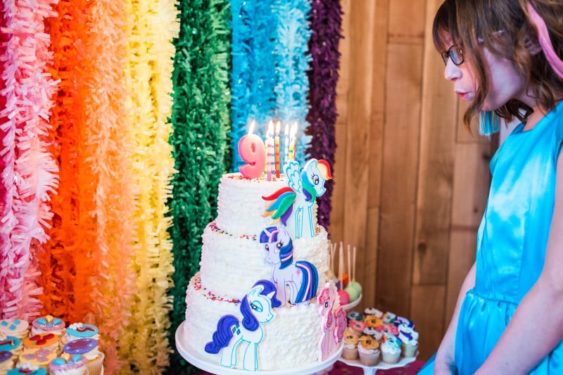 For Ally’s cake, I had initially thought of doing a cake covered in sprinkles, but once I had put the rainbow backdrop together, I realized it would have clashed and decided on a simple white ruffled buttercream with fondant ponies. Rebecca from Eye Candy Sugar does incredible work. I am still in awe of how gorgeous her work is. Look at those details!!