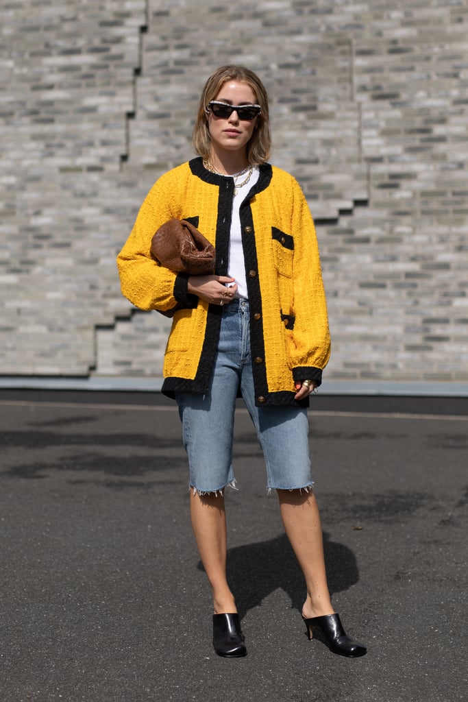 Switch up your proportions for opting for knee-length denim shorts and an oversize cardigan sweater.
