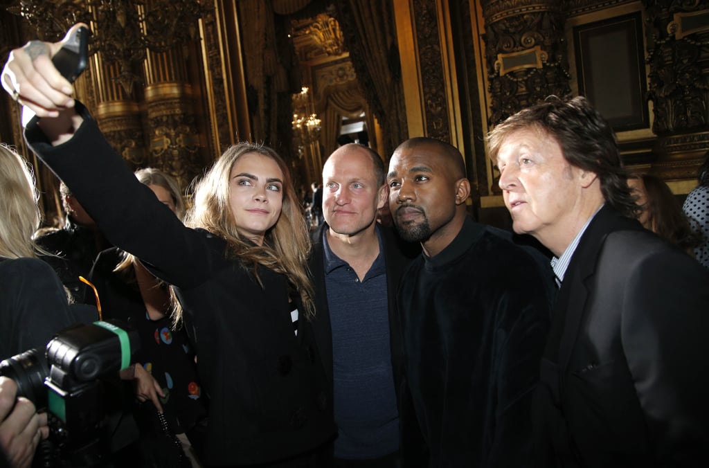 Cara Delevingne took a selfie with Woody Harrelson, Kanye West, and Paul McCartney at Stella McCartney's show during Paris Fashion Week in March 2015.