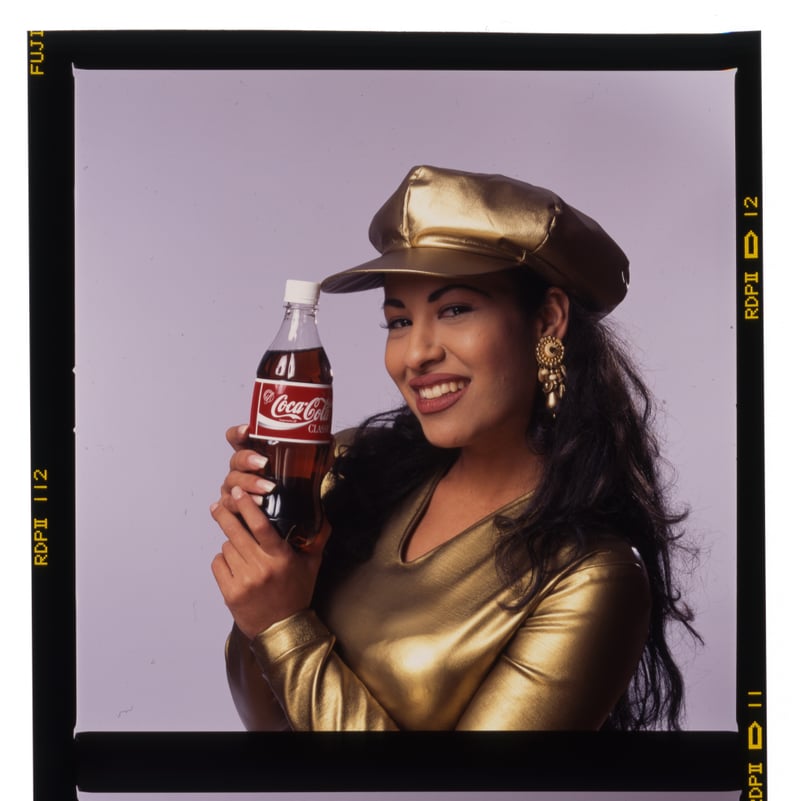 Selena in a Gold Lamé Top With Matching Hat For a Coca-Cola Campaign in 1994