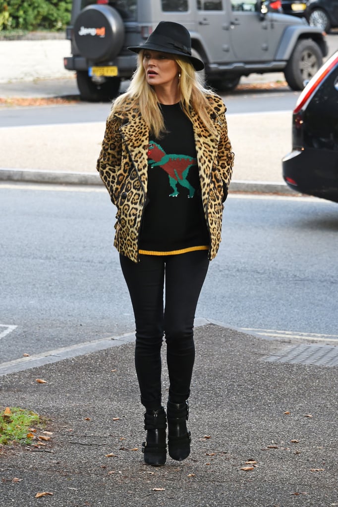 She accessorised her leopard print jacket with a black fedora when she went on a walk in North London in October 2016.