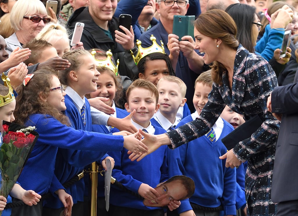 Kate shook hands with a young girl before leaving a reception at the National Football Museum in Manchester in October 2016.