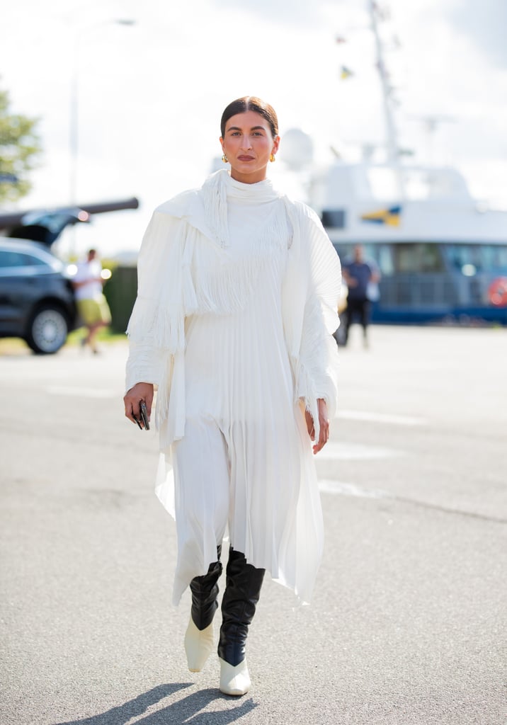 Layer your all white maxi dress with black leather pants. Layer your all white maxi dress with black leather pants.