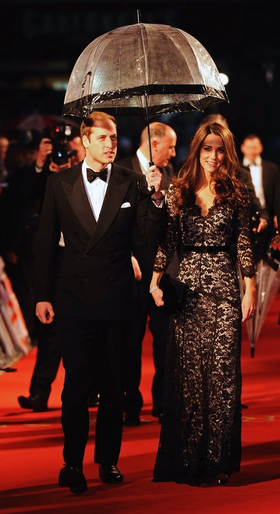 Prince William held an umbrella over Kate's head as they arrived on the red carpet for the London premiere of Steven Spielberg's War Horse in 2012.