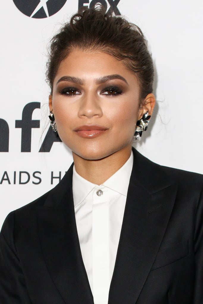 Her black, lucite, and diamond earrings were nothing short of sharp.