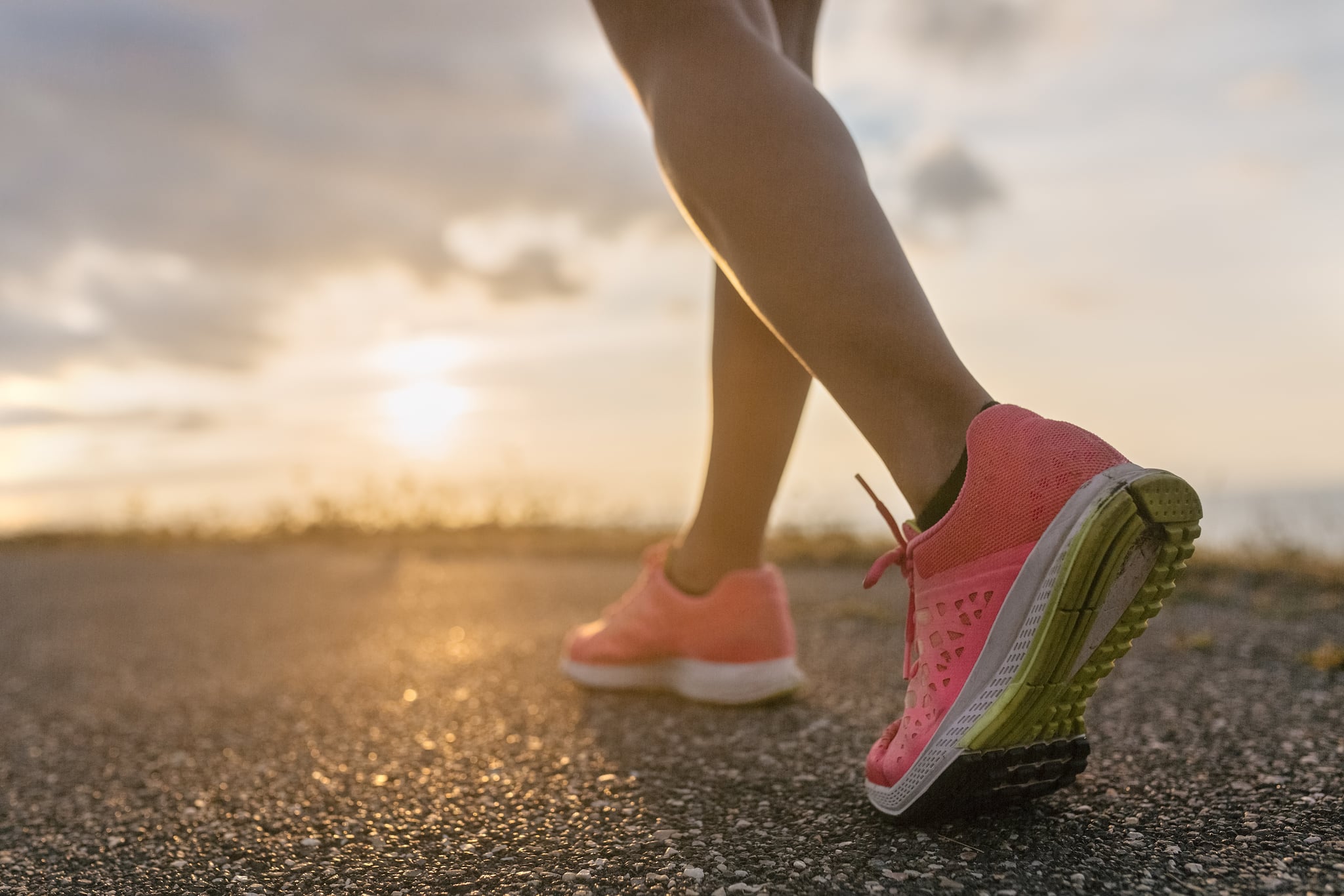 Gijón, Asturias, Spain,  detail of an athlete woman legs at sunset