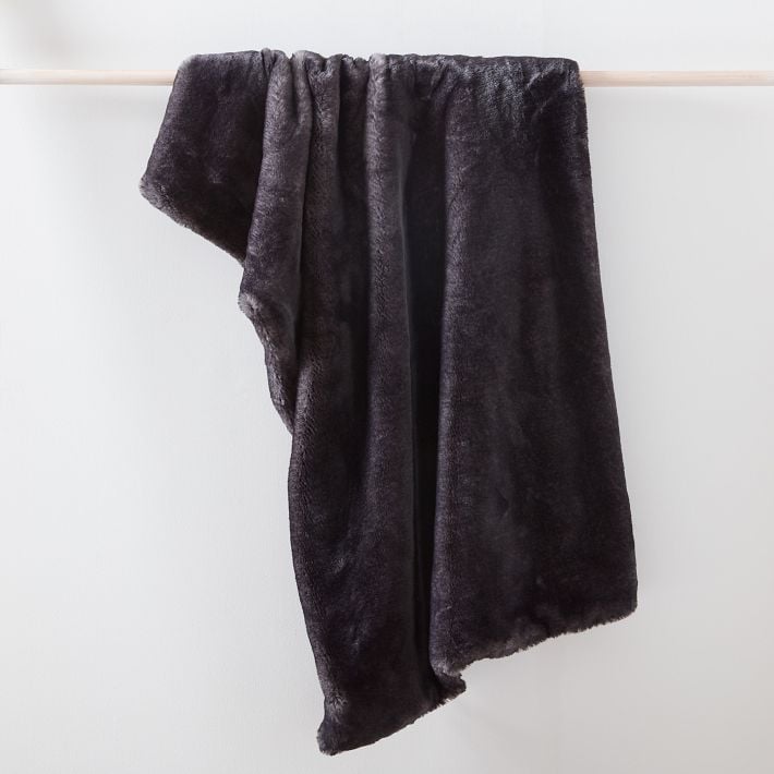 West Elm Faux Fur Chinchilla Throw ($89, originally $119)
This faux fur throw is the ultimate cozy-chic combo. The chinchilla-inspired texture looks luxe, and it  makes any sofa or chair feel like a little indulgence. I'd curl up with this all winter — no questions asked.