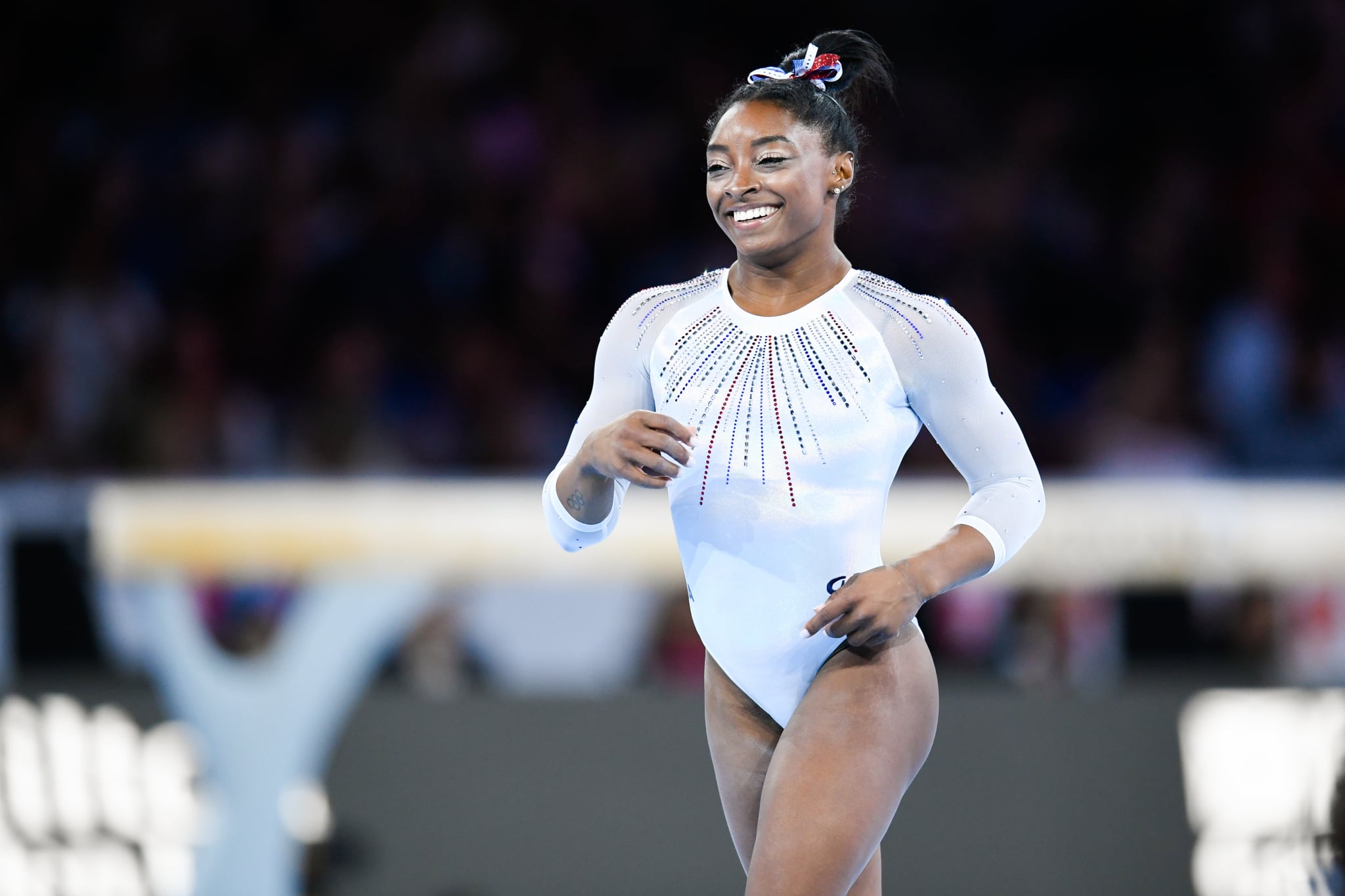 10 October 2019, Baden-Wuerttemberg, Stuttgart: Gymnastics: world championship, all-around, women, final. Simone Biles from the USA laughs after her exercise on the ground. Photo: Tom Weller/dpa (Photo by Tom Weller/picture alliance via Getty Images)