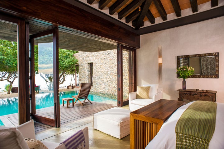 Between the two master suites, the "Keili" suite is surrounded by water. The bathroom even includes a shower that leads to the pool.