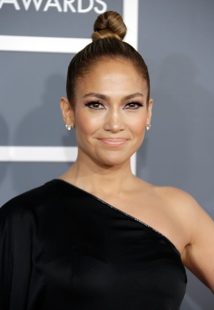 At the Grammy Awards, Jennifer Lopez went for a twisted and twirled topknot that put the focus on her exaggerated eye makeup.