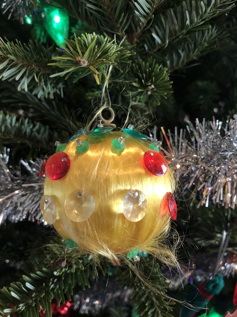 This Furry, Plastic-Gem-Adorned Ornament of Unknown Origin