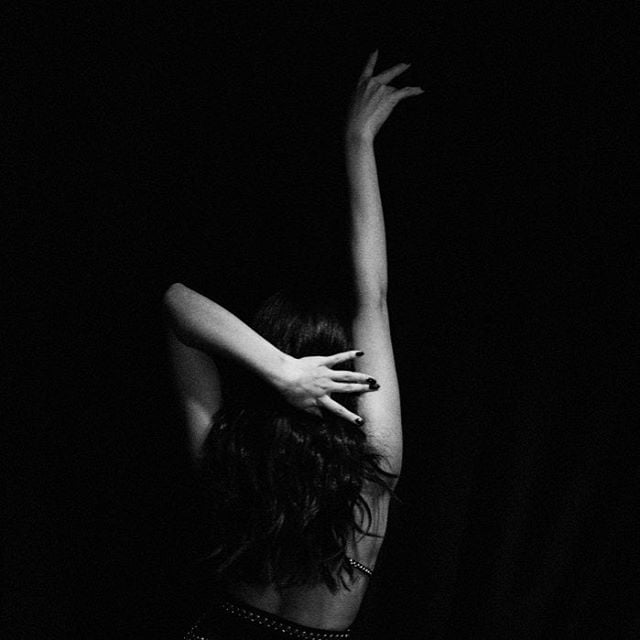 In a behind-the-scenes photo, Selena showed off her sexy moves.