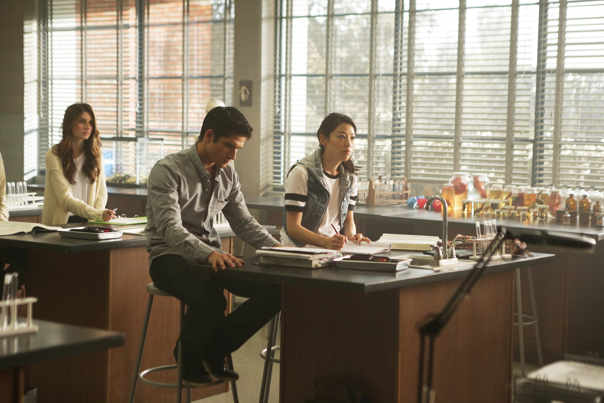 TEEN WOLF, Tyler Posey (centre), Arden Cho (right), 'Required Reading', (Season 5, ep. 506, aired July 27, 2015). photo:  MTV / Courtesy: Everett Collection