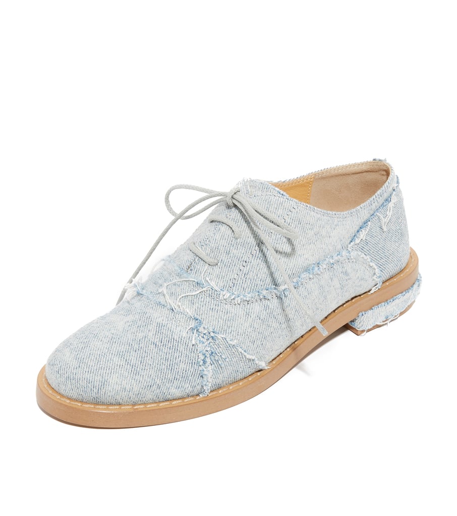 As you give the denim-on-denim trend a try, consider styling these Maison Margiela oxfords ($450) with your outfit. The distressed detail will make a street style statement.