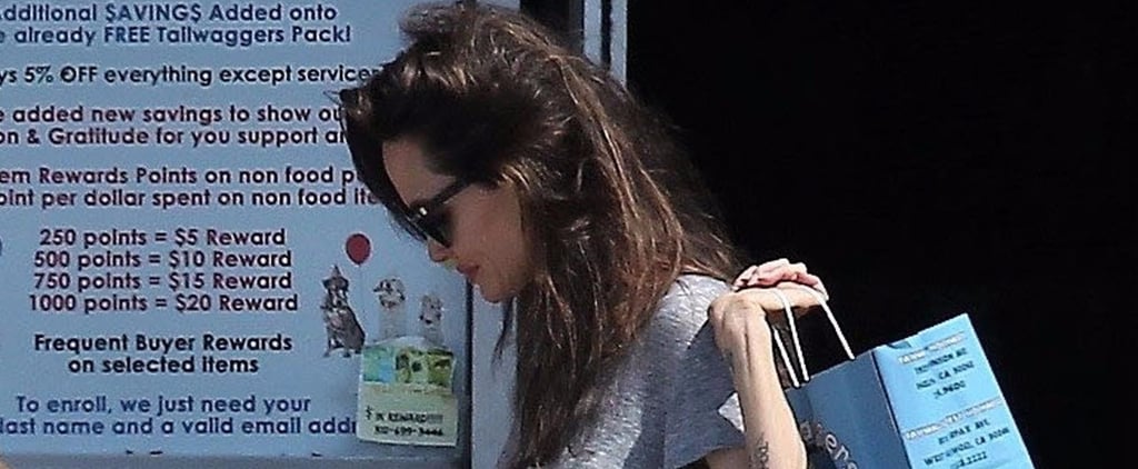 Angelina Jolie Wearing Gray Trousers