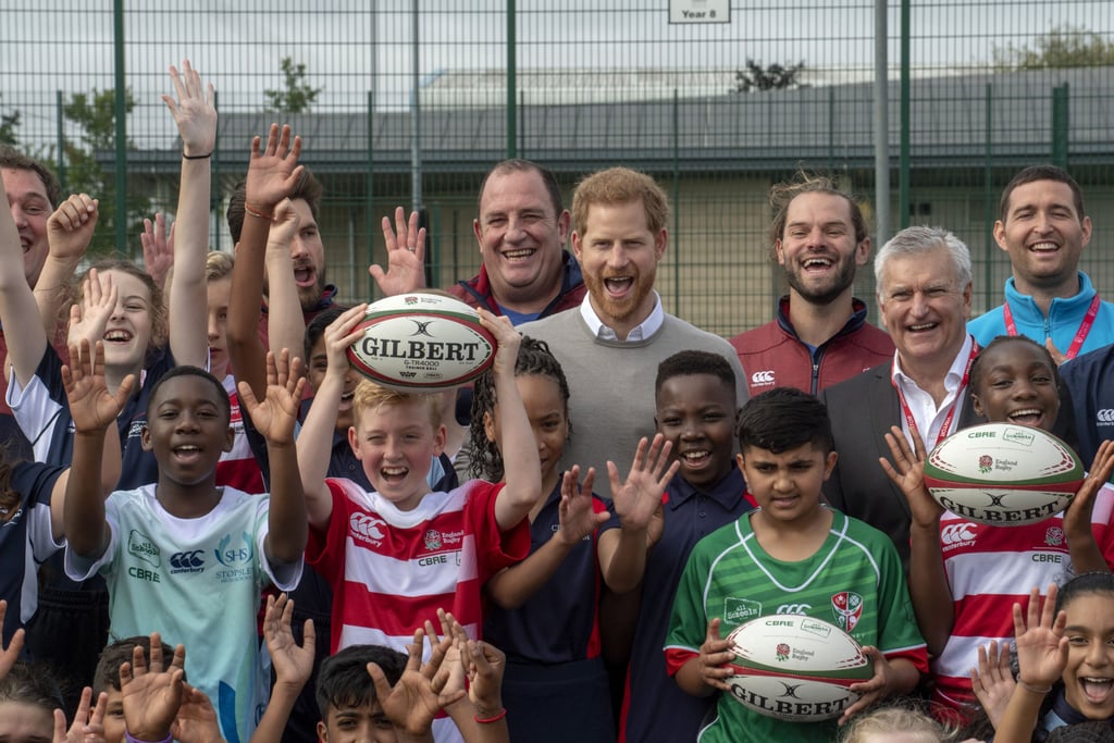 Prince Harry Hugs Kids at Lealands High School