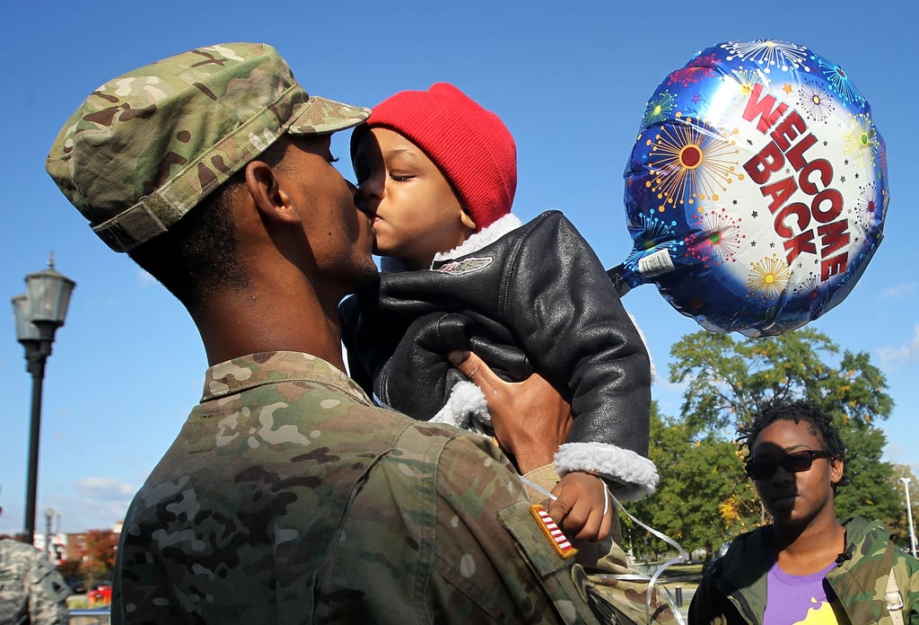 Specialist Marqes Turpin of the 273rd Military Police Company of DC Army National Guard kissed his 2-year-old son Josiah Turpin during a homecoming ceremony on Oct. 16, 2012, in Washington DC after a 10-month deployment to Afghanistan.