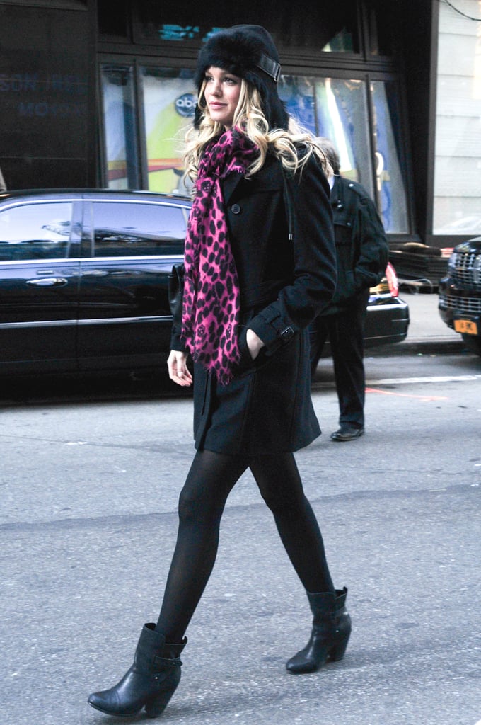 Erin Heatherton went head-to-toe black in NYC, then added a pop of print and color via her vibrant scarf.