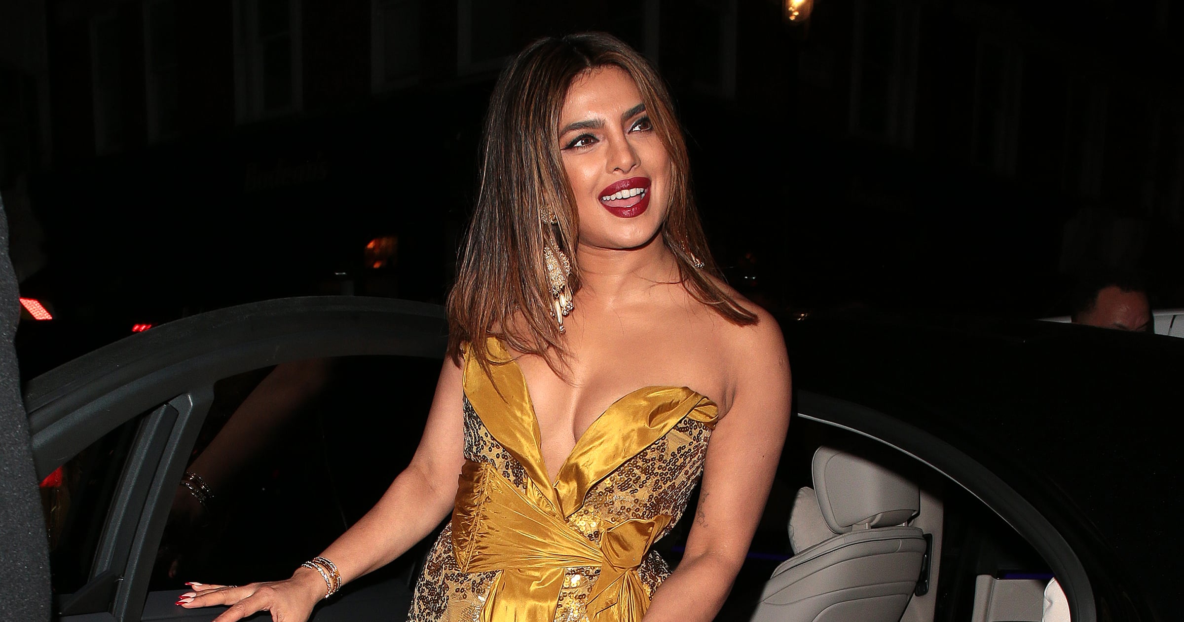 priyanka chopra gold dress : https://vogueindia.visitlink.me/qXZcK_ Priyanka Chopra Jonas wore a  feminine halterneck dress to a panel discussion in the French Riviera