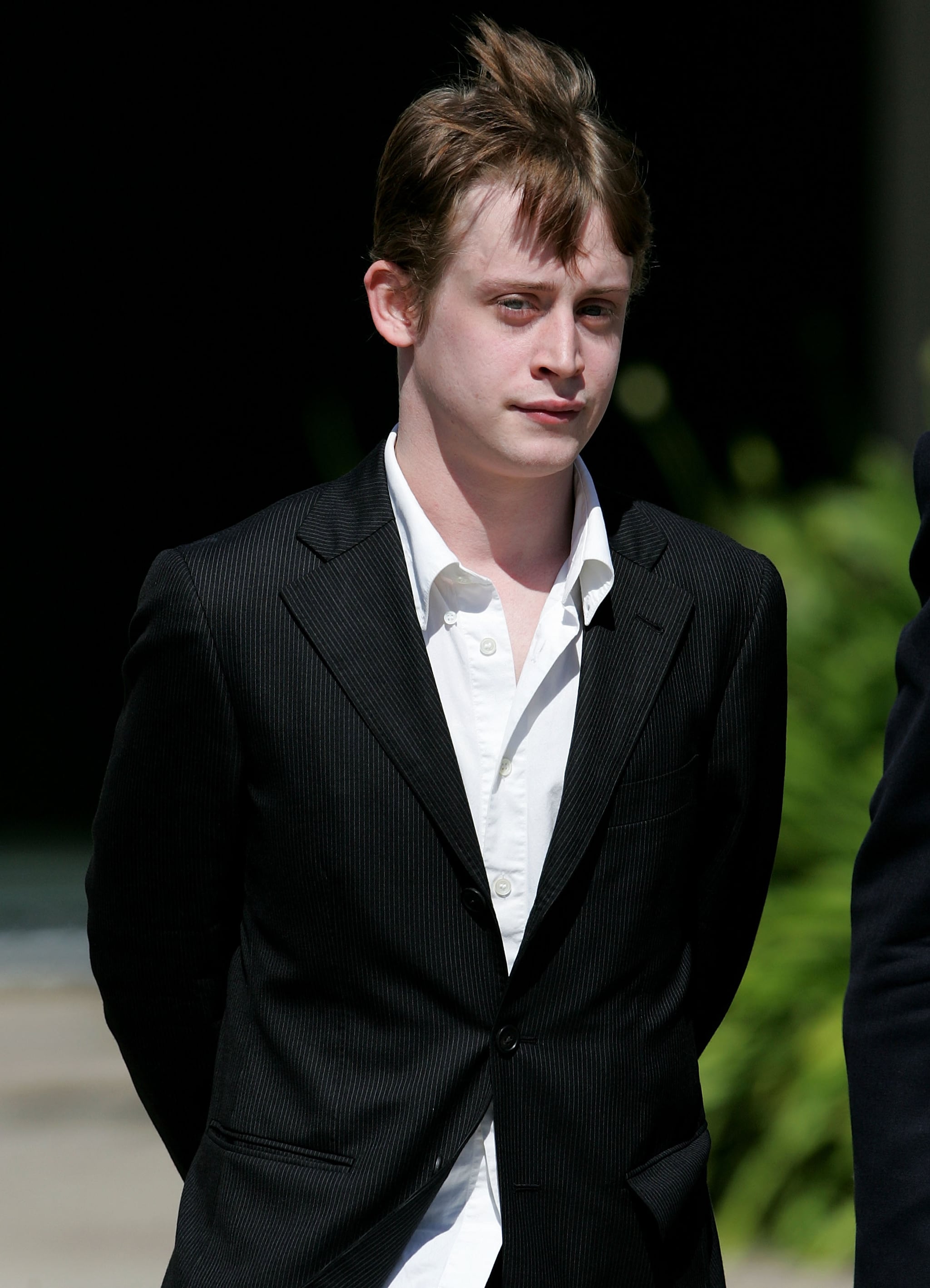 SANTA MARIA, CA - MAY 11:  Actor Macaulay Culkin leaves the Santa Barbara County Courthouse after testifying in Michael Jackson's child molestation trial May 11, 2005 in Santa Maria, California. Jackson is charged in a 10-count indictment with molesting a boy, plying him with liquor and conspiring to commit child abduction, false imprisonment and extortion.  (Photo by Justin Sullivan/Getty Images)