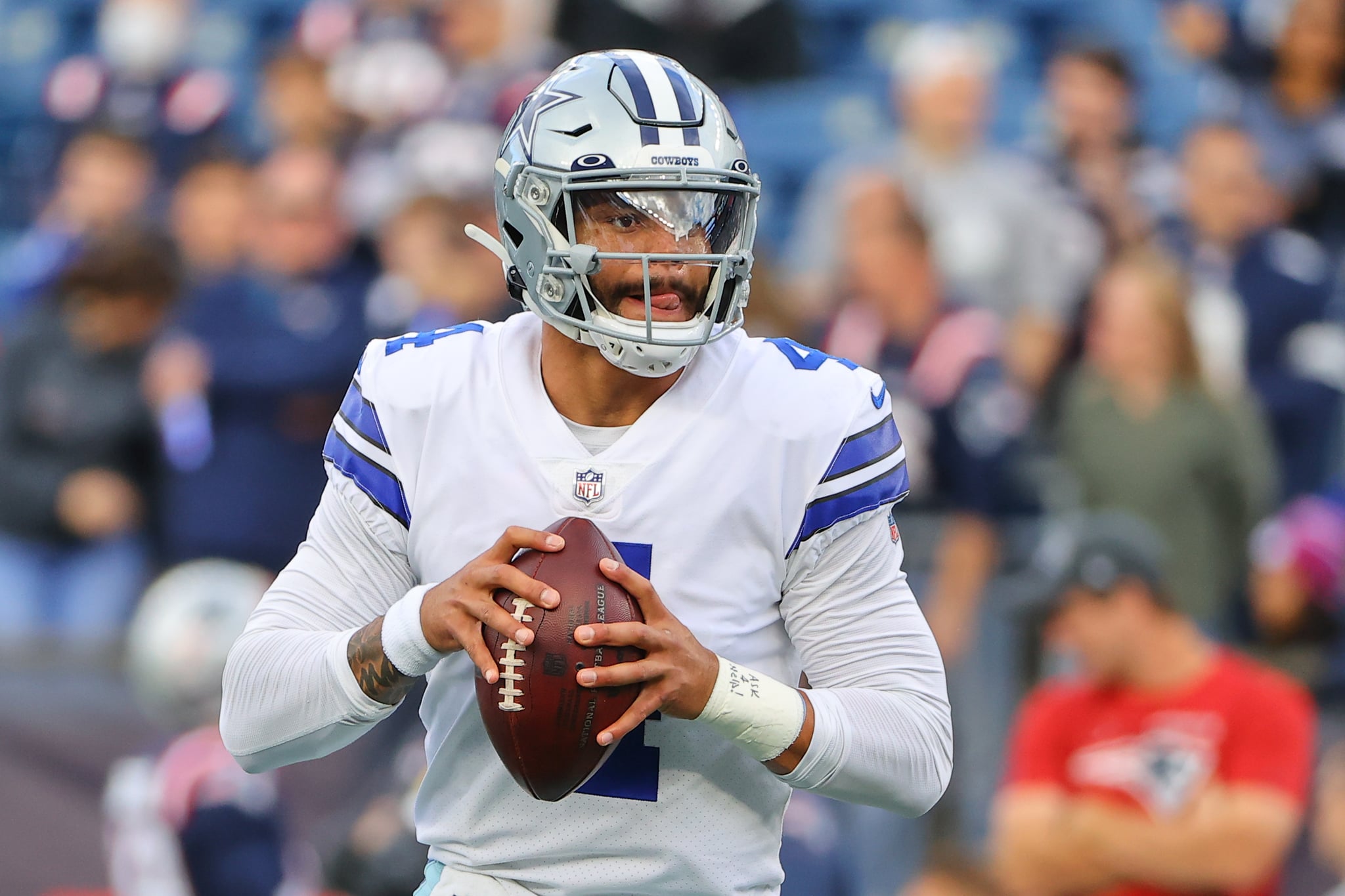 FOXBOROUGH, MA - OCTOBER 17:  Dallas Cowboys quarterback Dak Prescott (4) warms up  prior to the National Football League game between the New England Patriots and the Dallas Cowboys on October 17, 2021 at Gillette Stadium in Foxborough, MA.    (Photo by Rich Graessle/Icon Sportswire via Getty Images)