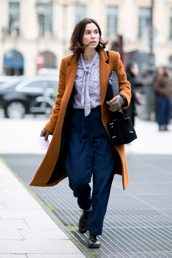 Bringing '70s chic to 2014 with a tie-neck blouse and trousers.