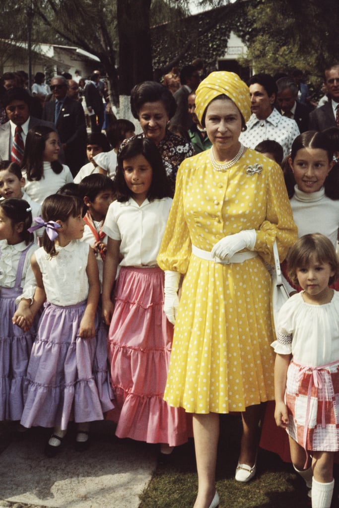 The Queen channels Elizabeth Taylor in a yellow turban on a trip to Mexico in 1975.