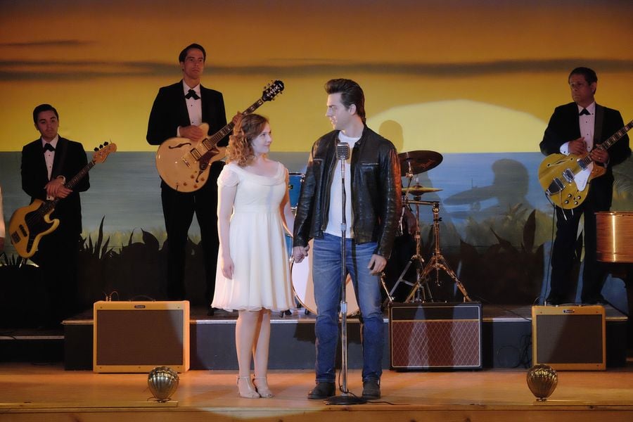 Here she is looking into Johnny's eyes lovingly.