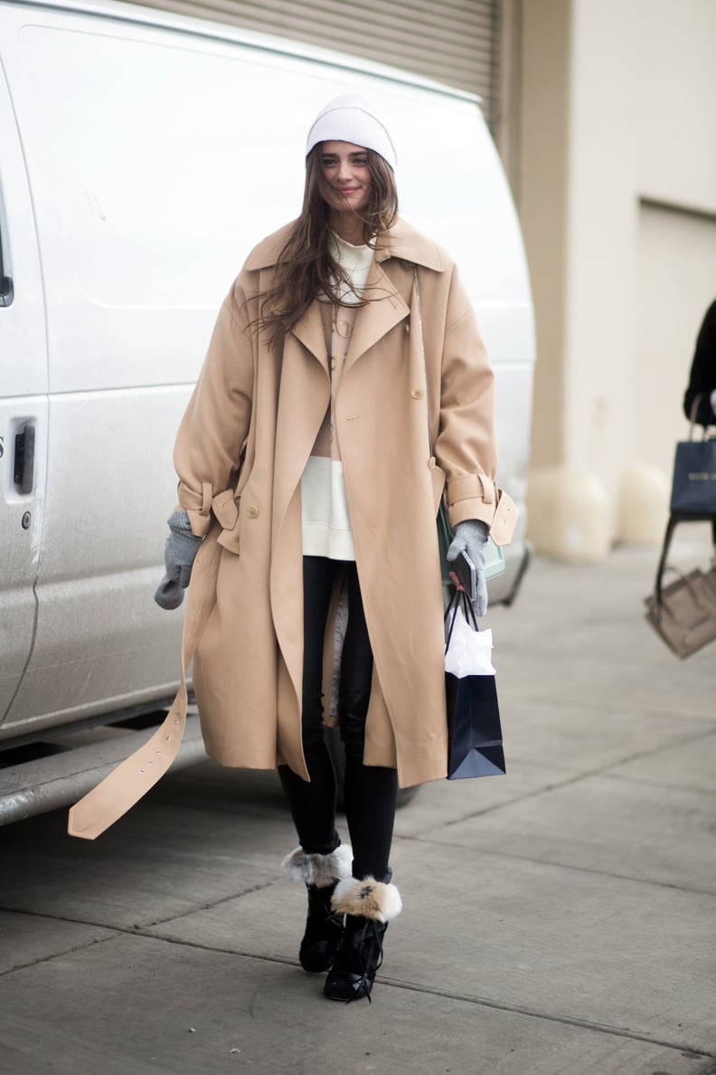 With a warm sweater, elegant coat, and furry boots — comfy doesn't have to be frumpy.