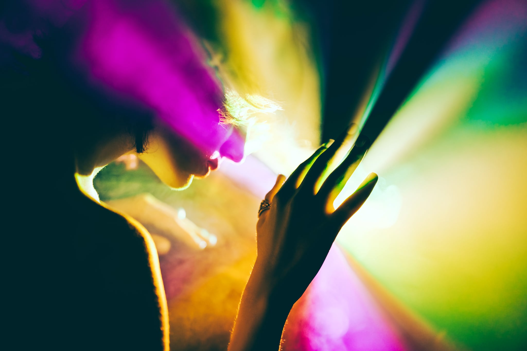 A futuristic woman exploring bright and colorful outer space.