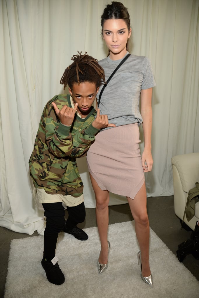 Kendall and Jaden Smith showed off their casual-cool looks. While Jaden opted for a loose tee and a camouflage sweatshirt, Kendall wore a lightweight gray tee, an asymmetrical taupe bandage skirt by Jonathan Simkhai, and silver metallic pumps. She accessorized with a Michael Kors crossbody bag.