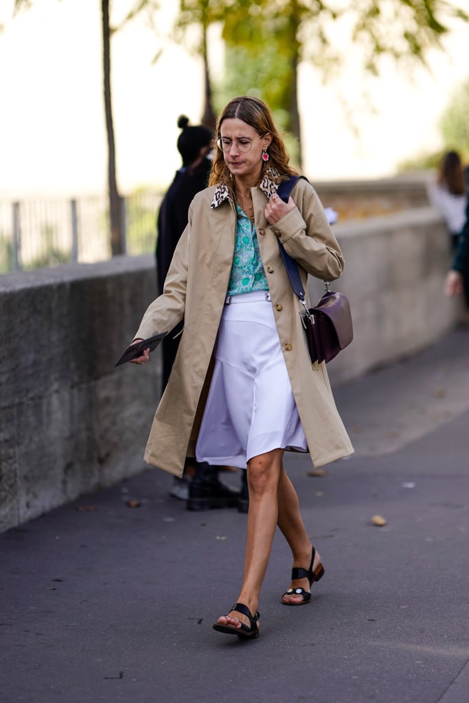 Pair your embellished sandals with a trench coat, printed top, and white skirt.